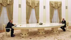 путін