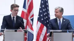MI5 head Ken McCallum (left) and FBI director Christopher Wray (right)