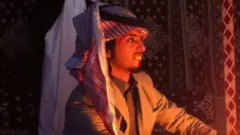 A camel trader in a tent at the camel market just outside Riyadh