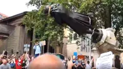 Protesters tear down Edward Colston statue in Bristol
