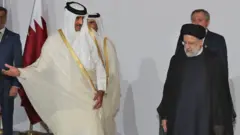 أمير قطر والرئيس الإيراني حلال القمة السادسة لمنتدى الدول المصدرة للغاز في 22 فبراير/شباط الماضي
