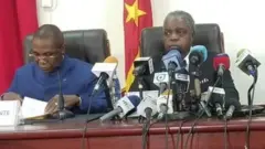 Health Minister in blue dress wit oda ministers for presser
