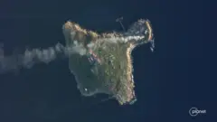 Satellite view shows smoke rising over Snake Island, Ukraine amid Russia"s attack on the country, May 8, 2022