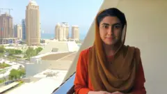 Shazia Haya recording on the balcony of a Doha hotel room