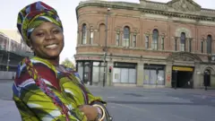 Woman wey dey smile for UK