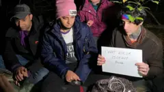 Iraqi migrants hiding in a Polish forest near the Polish town of Chelm shortly after crossing the border from Belarus.
