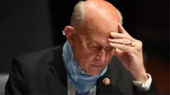 Gohmert with his mask lowered