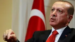 Turkish President Tayyip Erdogan speaks during an interview in New York on 19 September 2016.