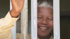 Nelson Mandela revisits the cell at Robben Island prison in 1994