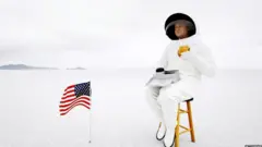 A stock image of an astronaut eating a hamburger