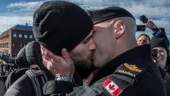 Canadian Armed Forces tweet showing two men kissing
