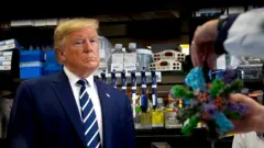 Trump speaking to scientists at a vaccine research centre