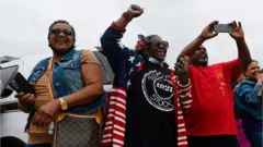 People cheer as Biden arrives in Greenwood