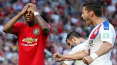 Marcus Rashford ati Joel Ward