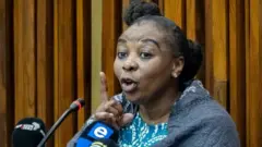 Nomia Rosemary Ndlovu gestures at the South Gauteng high Court in Johannesburg on September 27, 2021