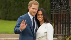 Prince Harry and Meghan Markle in the Sunken Garden at Kensington Palace
