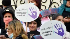 unisian women demonstrate on March 6, 2021 in Tunis against violence against women