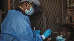 For Gauteng Health Department Official collect samples from one man during door-to-door COVID-19 coronavirus testing drive in Yeoville, Johannesburg,