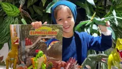 Theo Costa Ribeiro playing with dinosaurs