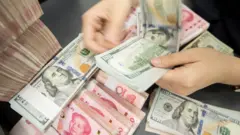 Uang yuan dan dolar