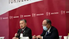 Tokyo 2020 chief executive Toshiro Muto speaks to the media