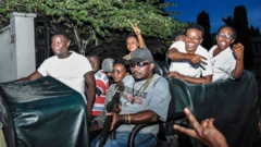 Chadema politicians wave to their supporters outside a magistrate's court in Dar es Salaam, Tanzania - Tuesday 10 March 2020