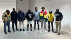 Eight men dey stand