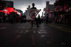 Activists Stage Anti-Government Protest As Bangkok Lifts Covid Curfews
BANGKOK, THAILAND - OCTOBER 31: A protester brandishes a flag, calling for abolishment of Section 112 (Lese majeste law) while attending the anti-government gathering in downtown on October 31, 2021 in Bangkok, Thailand. After a brief declines of protest activities, thousands of anti-government protesters attend the gathering amidst the heavy rain in downtown, calling for resignation of Gen. Prayut Chan-o-cha, release of protest leaders, and abolishment of the lese majeste law. (Photo by Sirachai Arunrugstichai/Getty Images)