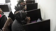 Three ladies siddon for cubicle