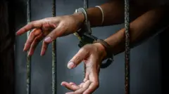 Woman dey behind bars
