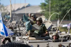 IDF Soldiers ride in armoured personnel carriers 