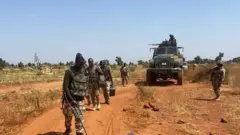 Nigeria Army officers searching di areas wit bomb detectors