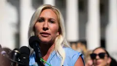 Marjorie Taylor Greene speaks at a press conference alongside alleged victims of Jeffrey Epstein at the US Capitol in September