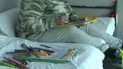 Woman on bed in converted office