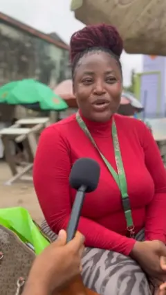 A Nigerian woman speaking to the mic
