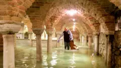 The flooded crypt of St Mark's Basilica is pictured during exceptionally high water levels in Venice, Italy, 13 November 2019