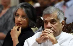 Sri Lanka Prime Minister Ranil Wickremesinghe (R) and his wife Maithree Wickramasinghe (L) look on during a literary festival in Galle on January 16, 2016.
