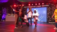 Teams dey compete wit dance and entertainment.