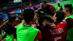 Les joueurs tunisiens célèbrent leur victoire.