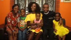 Catherine Okoro with her pikin dem
