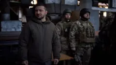 зе