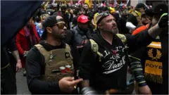 Proud Boys march in protest in December in Washington DC