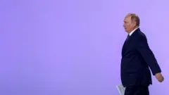 путін