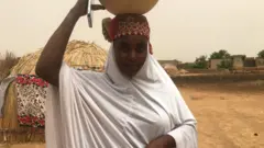 Fatima Jauro wit her calabash of fura