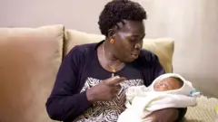 Jemima Okutu na mwanawe