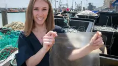 Lucy holding the plastic