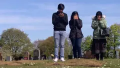 family praying