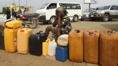 Woman look frustrated as she never fit buy fuel