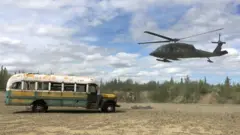 bus having been lifted to the east side of the teklanika river