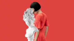 Woman and statue